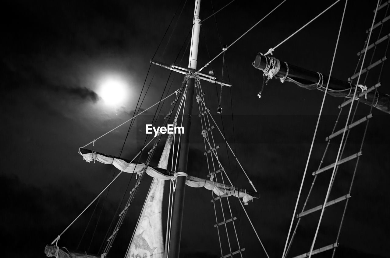 Low angle view of sailboat against sky at night