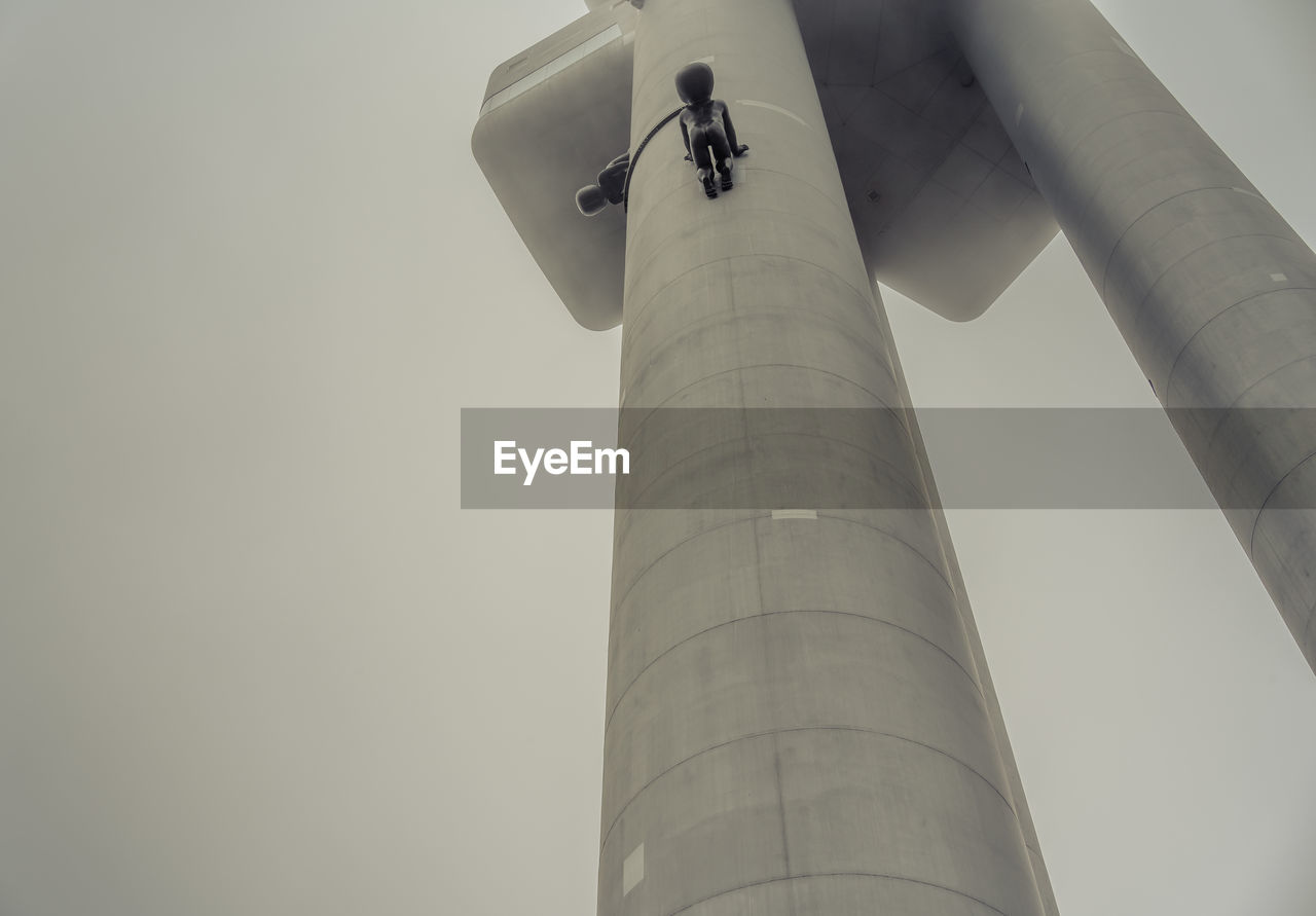 LOW ANGLE VIEW OF COMMUNICATIONS TOWER AGAINST CLEAR SKY