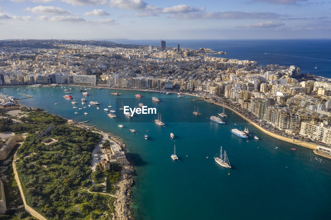 Malta, central region, sliema, aerial view of boats sailing around manoel island