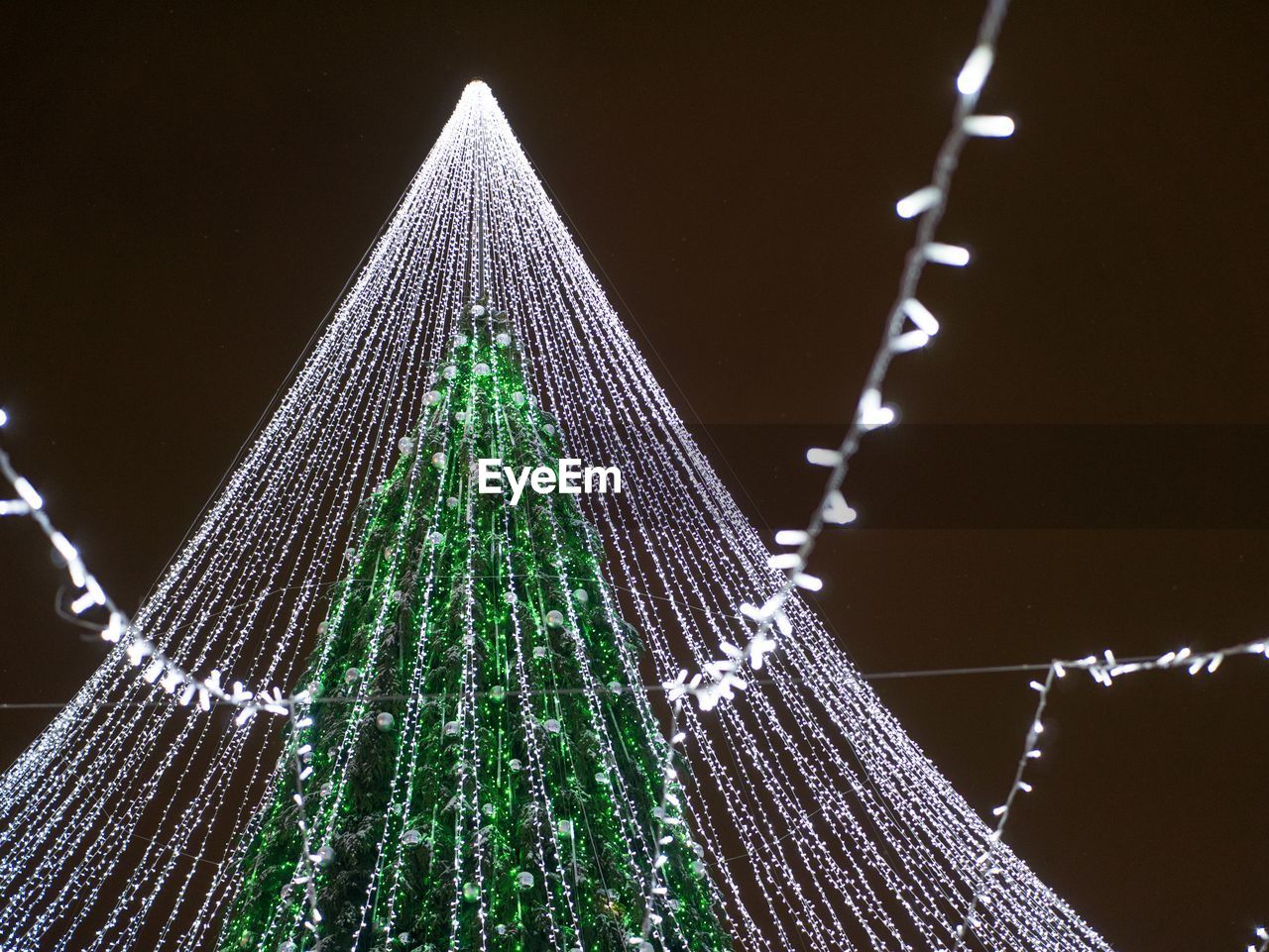 LOW ANGLE VIEW OF CHRISTMAS TREE AGAINST SKY