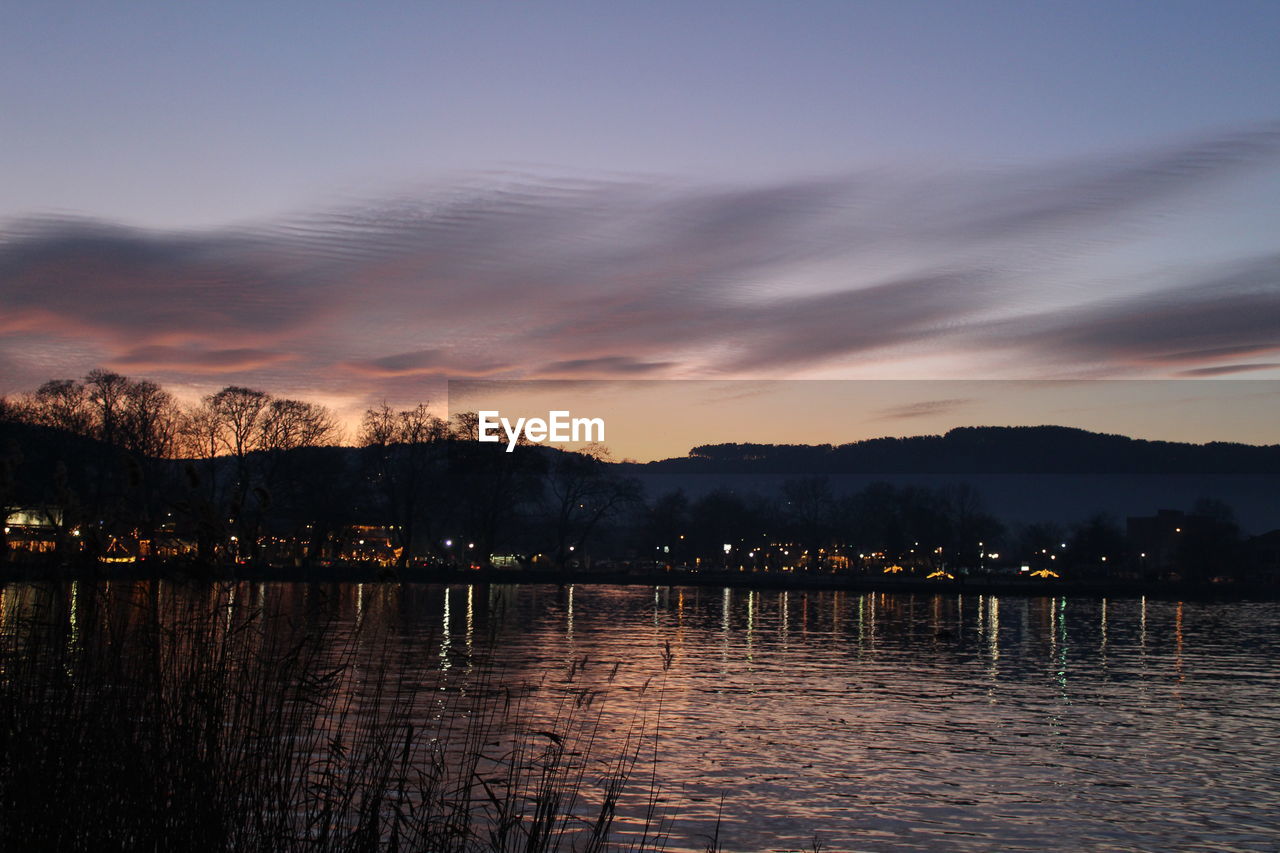 LAKE AGAINST SKY DURING SUNSET