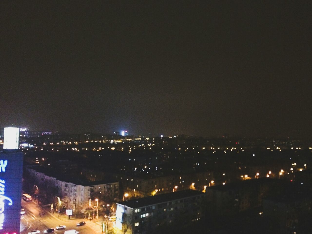 ILLUMINATED CITYSCAPE AT NIGHT