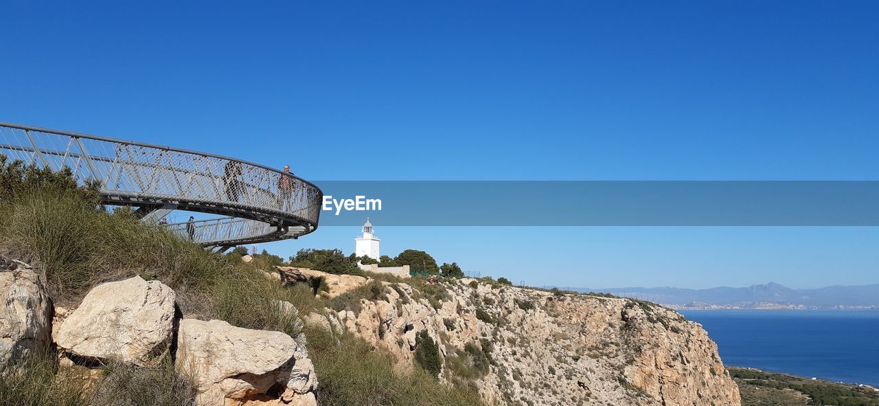 Scenic view of mountain against clear blue sky