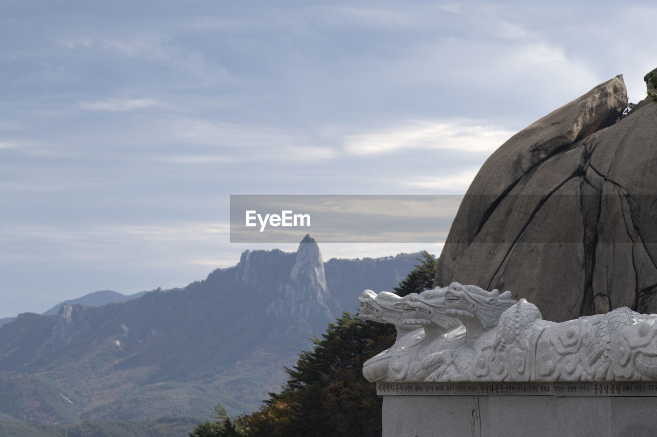 mountain, sky, cloud, scenics - nature, nature, environment, beauty in nature, mountain range, rock, snow, travel destinations, no people, landscape, travel, architecture, day, outdoors, tranquility, cold temperature, tourism, tranquil scene, land, winter