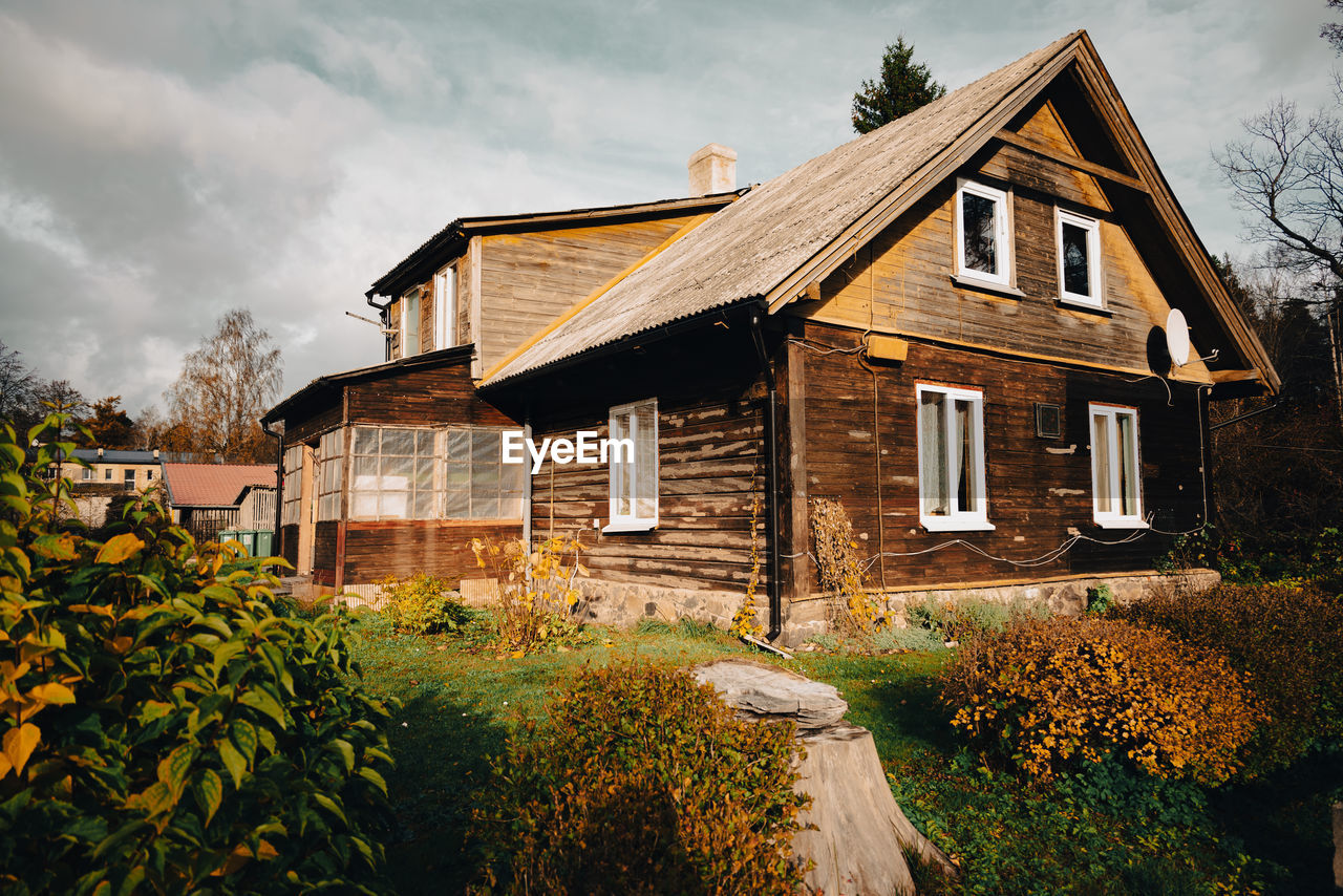 An old wooden house on a sunny autumn day in the countryside of latvia