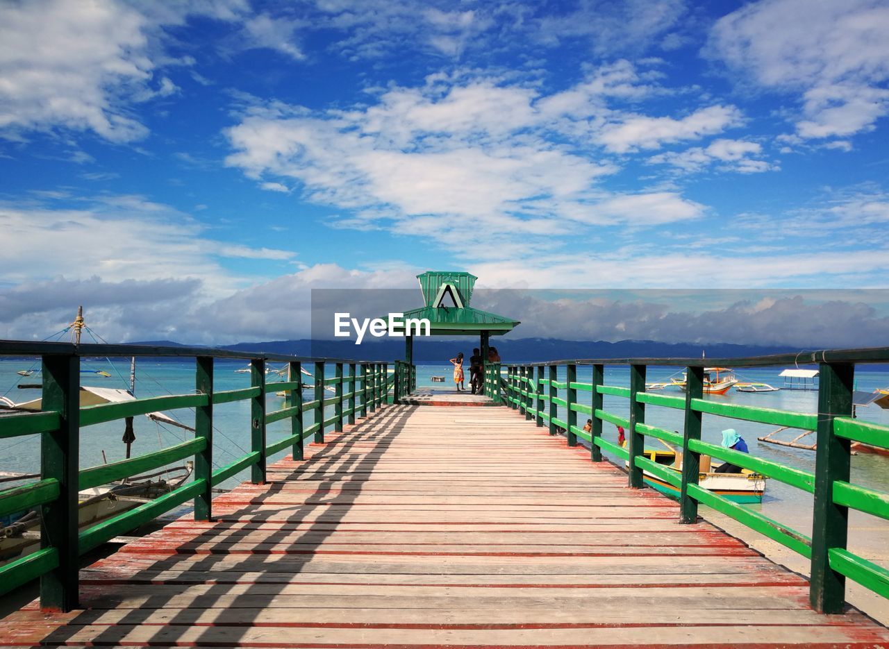 Pier over sea against sky