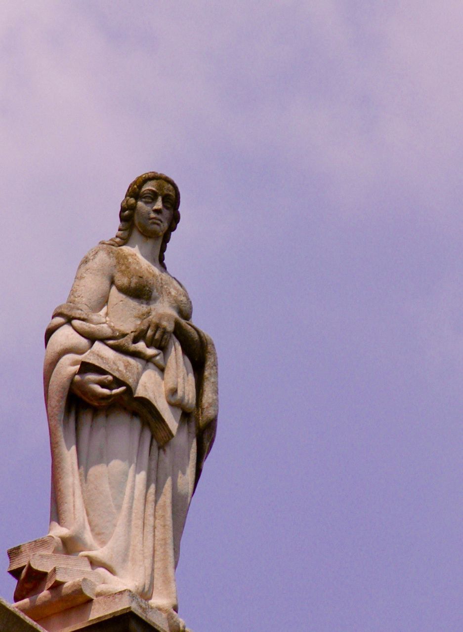 Low angle view of statue against sky