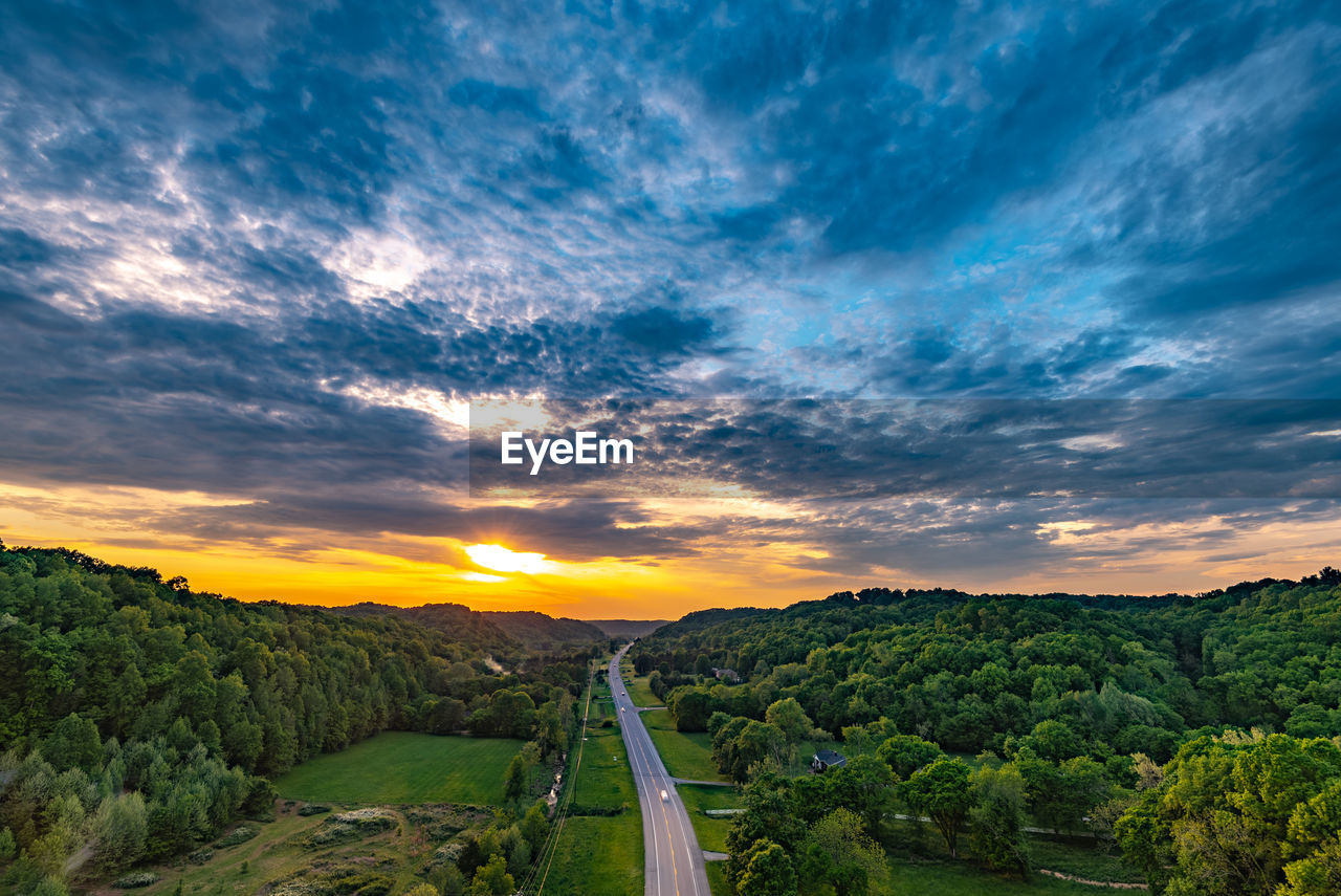 Scenic view of landscape against sky during sunset