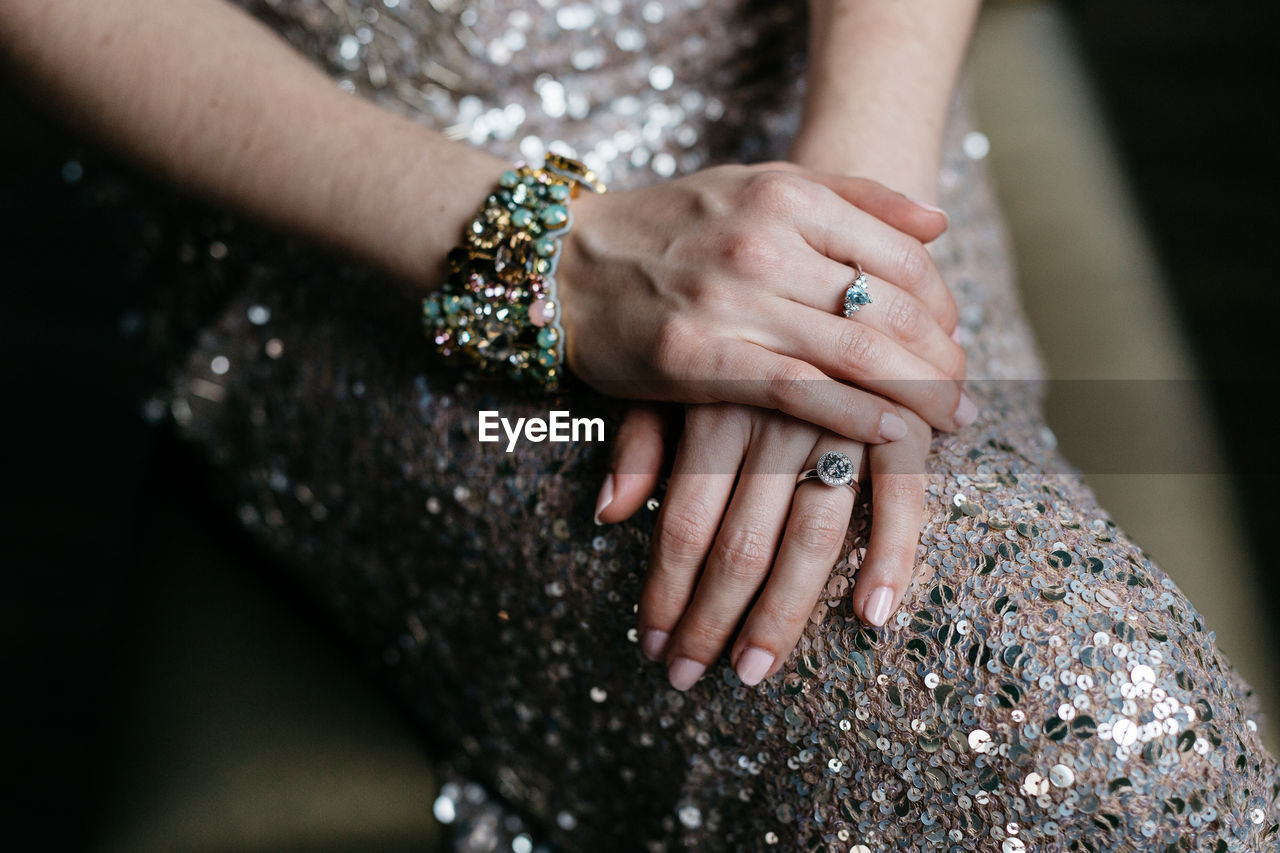 Midsection of bride wearing bracelet