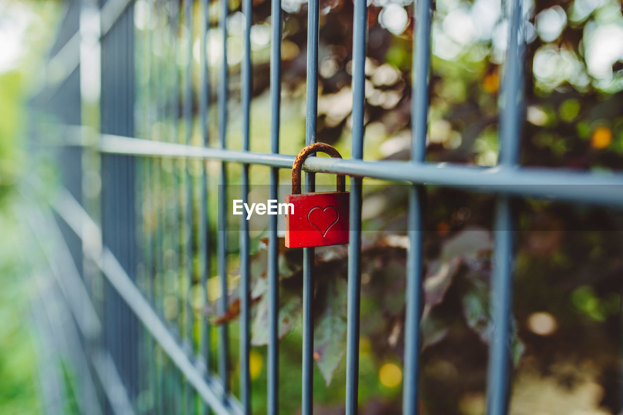 Close-up of padlock on railing