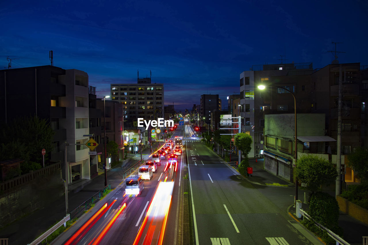 high angle view of light trails on road at dusk