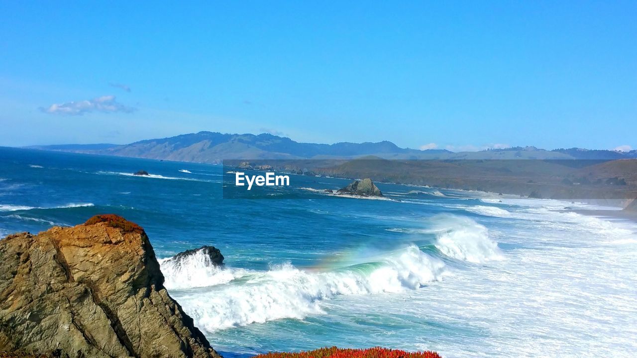 SCENIC VIEW OF SEA AGAINST BLUE SKY