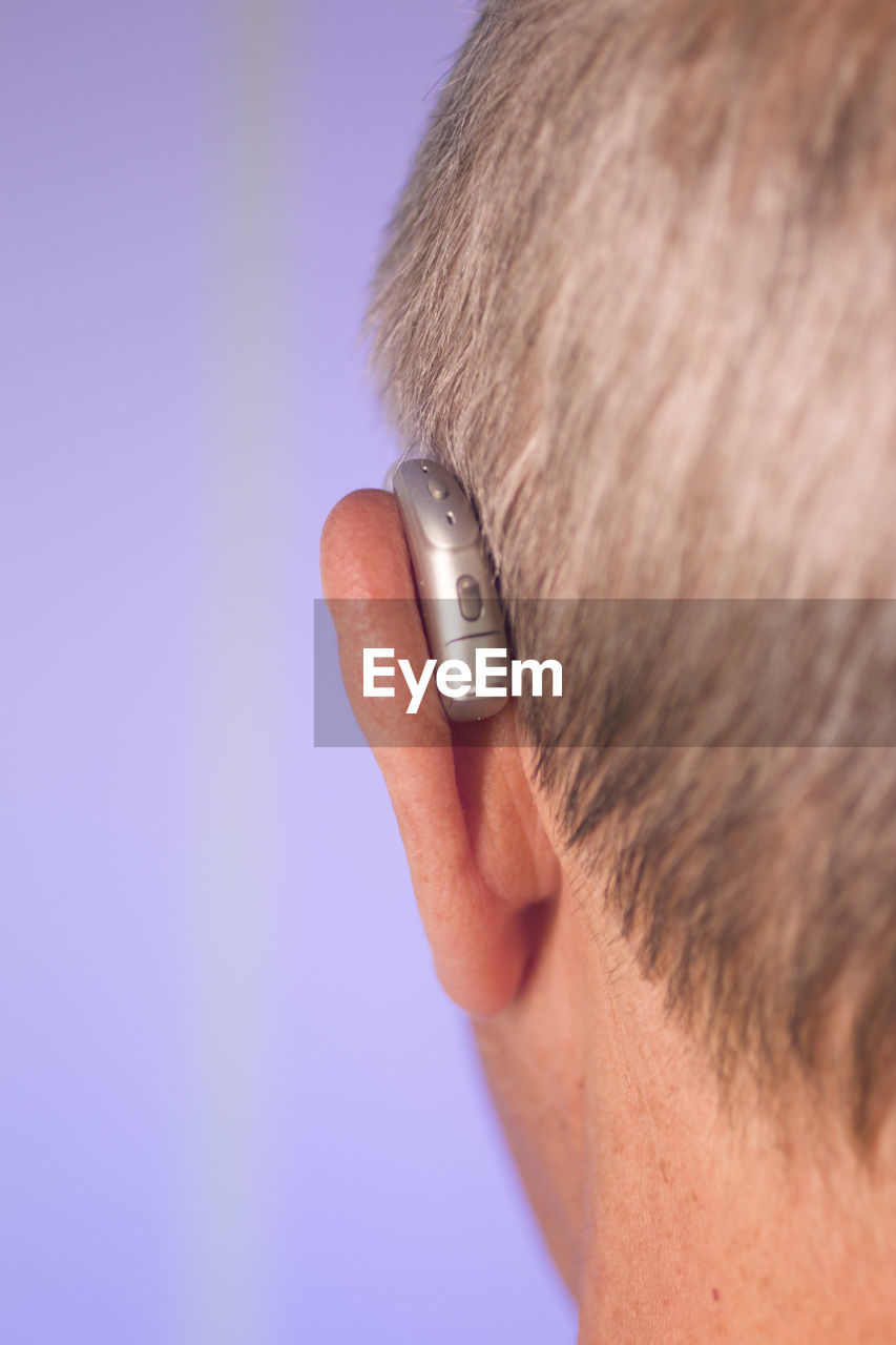 Close-up of man wearing hearing aid