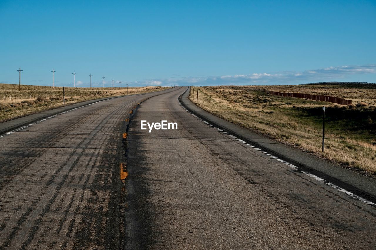 Road amidst landscape against clear sky