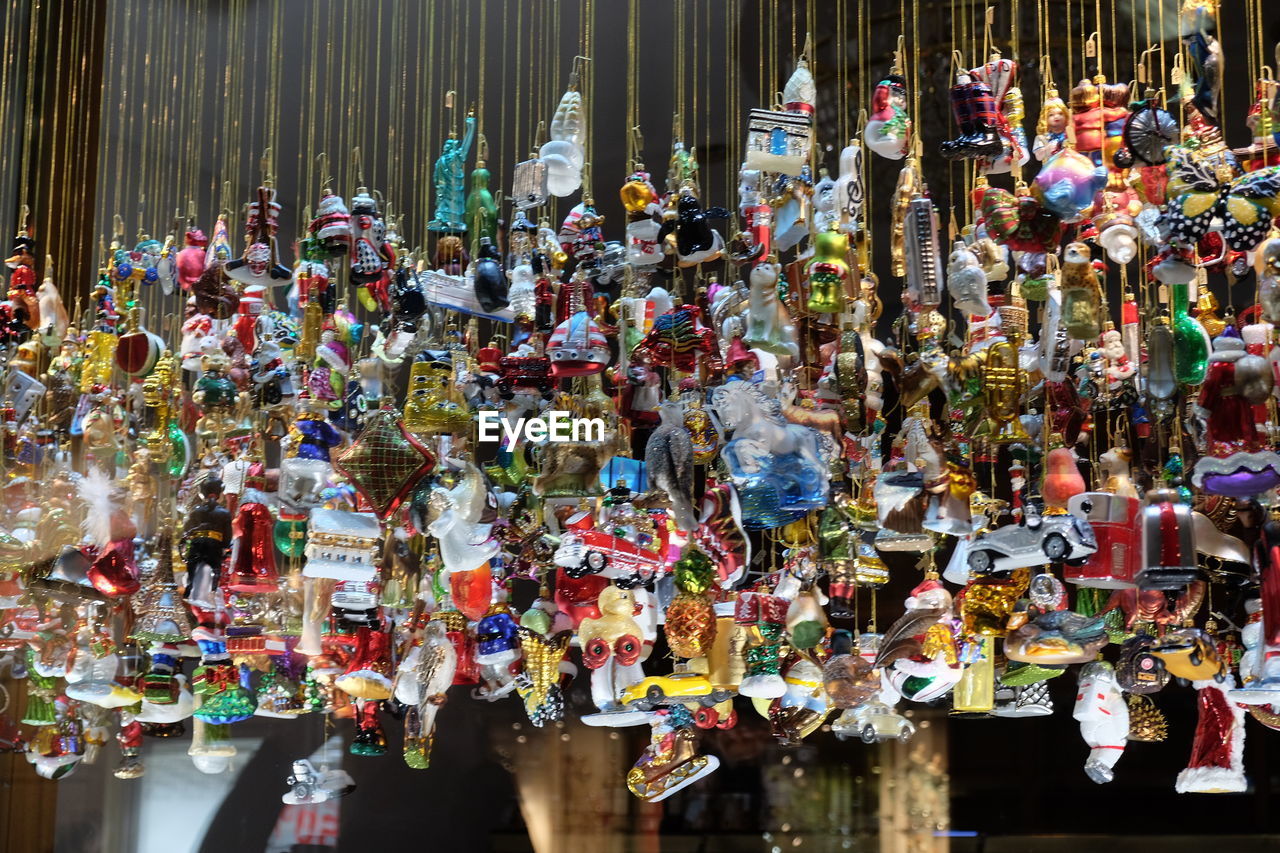 Various souvenir hanging for sale at market stall