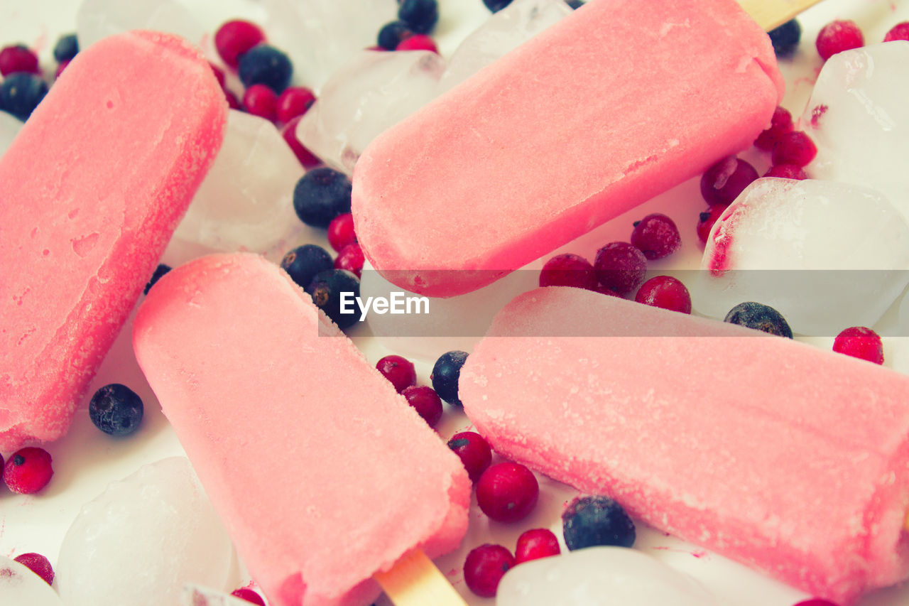 CLOSE-UP OF ICE CREAM AND FRUITS IN FROZEN