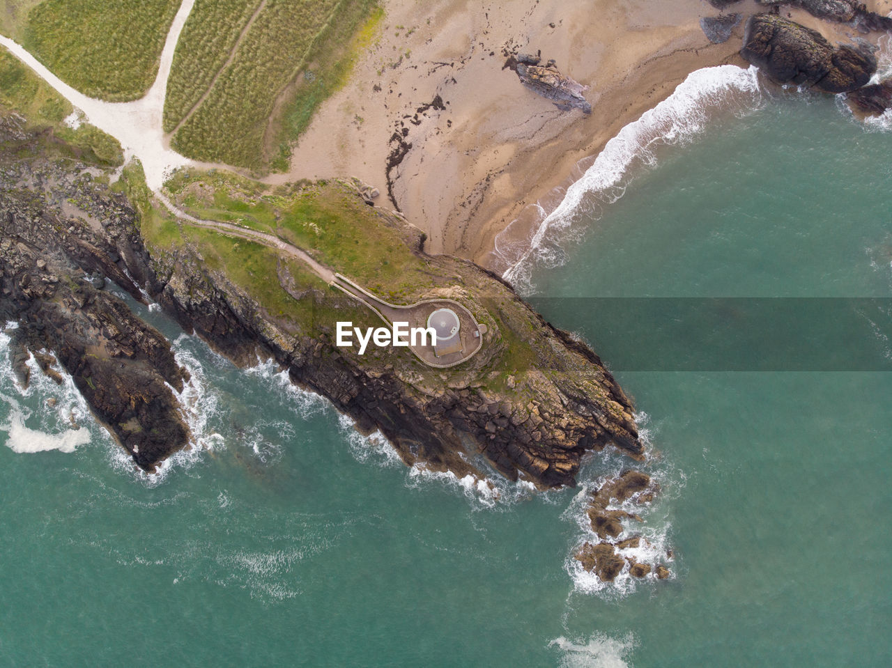 Above the lighthouse up in the sky looking down on the coastline