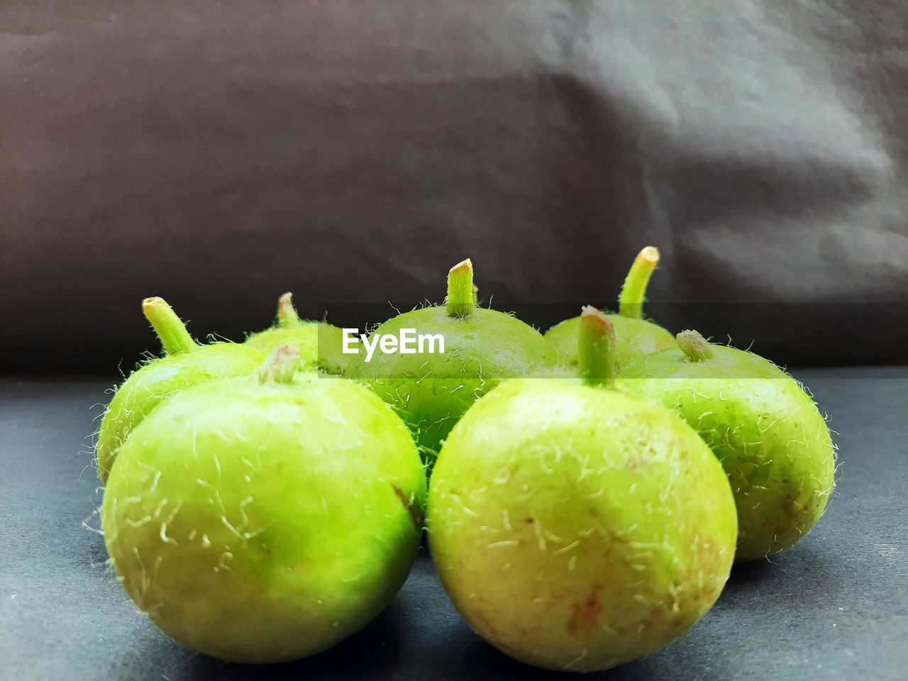 CLOSE-UP OF WET GREEN TABLE