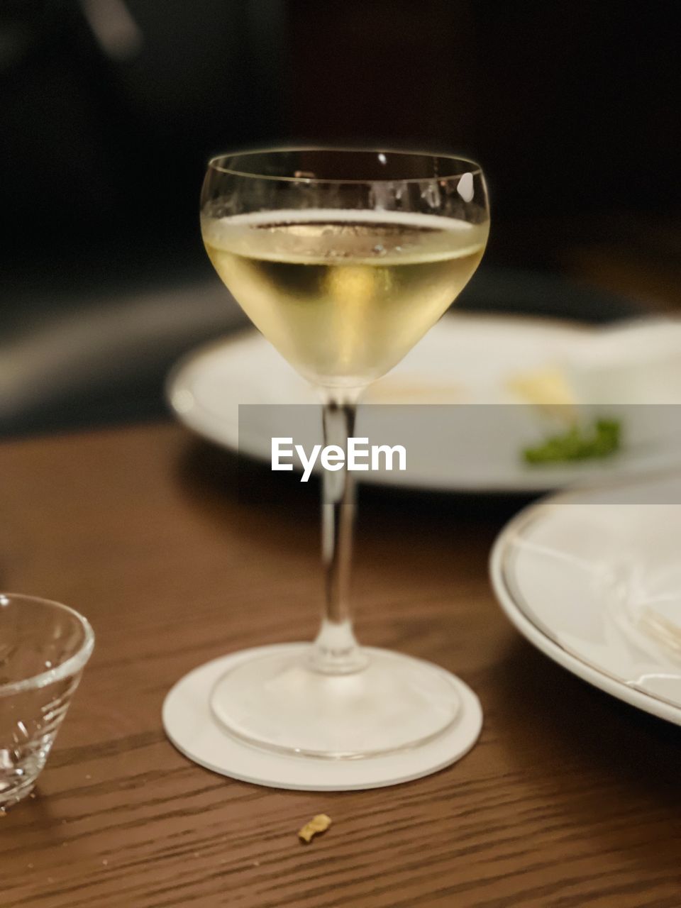food and drink, glass, alcohol, drink, refreshment, food, table, drinking glass, household equipment, wine glass, no people, tableware, indoors, alcoholic beverage, wine, freshness, focus on foreground, plate, close-up, wood, still life, cocktail, martini glass
