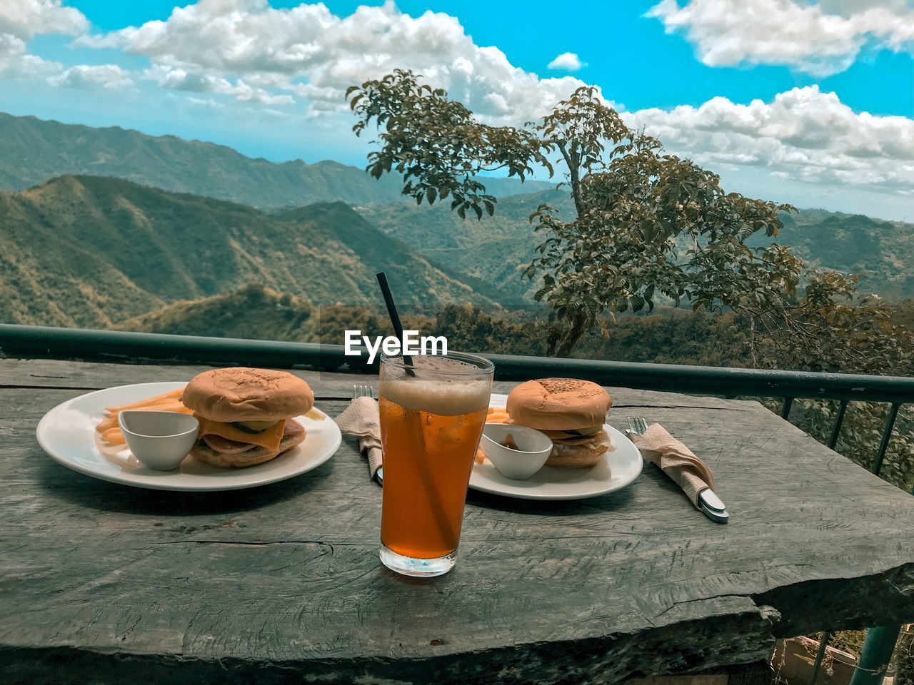 Breakfast on table against mountains