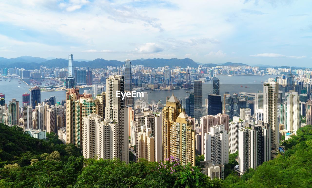 Panoramic view of city and buildings against sky