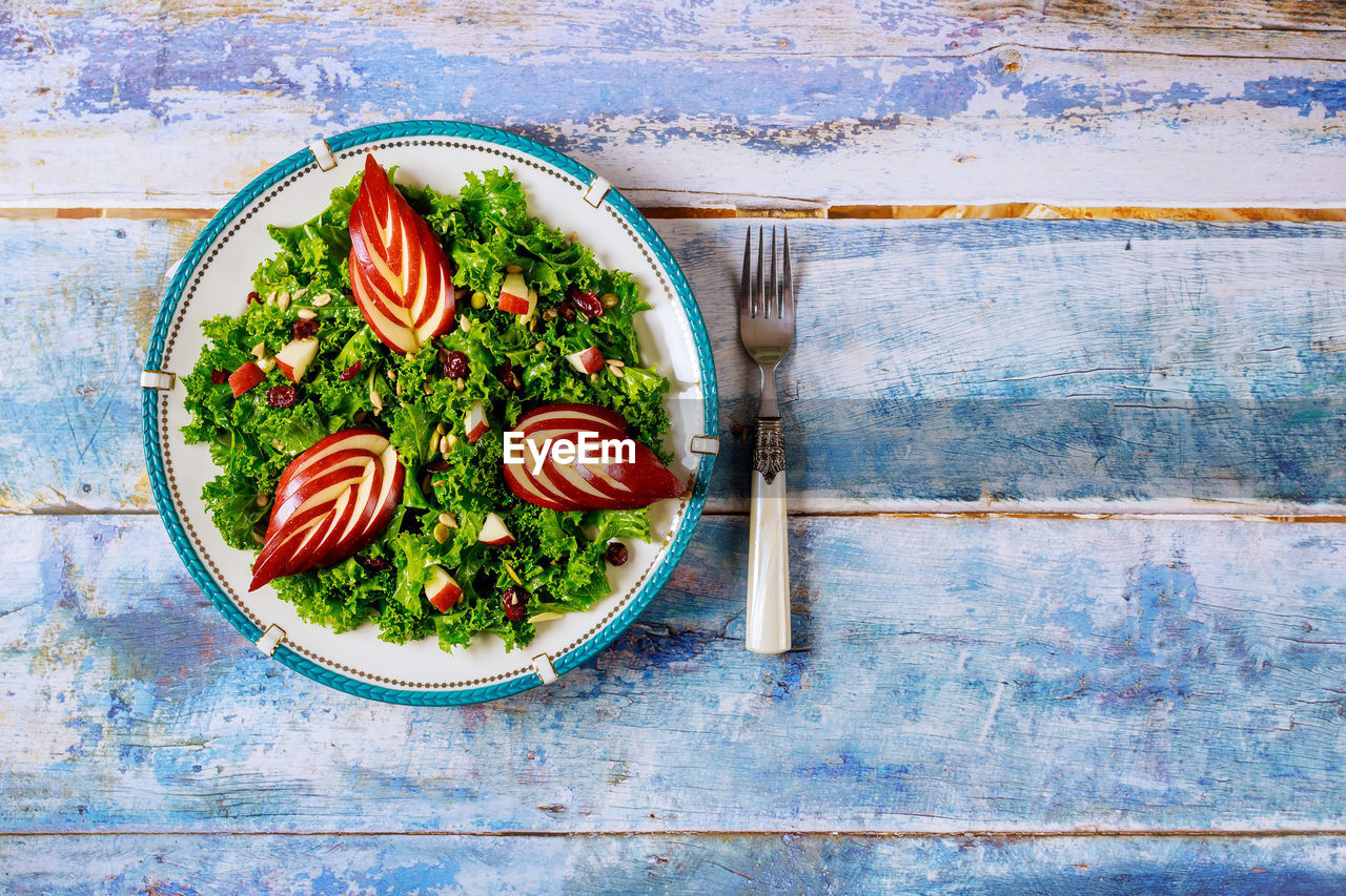 HIGH ANGLE VIEW OF FRUITS ON TABLE AGAINST WALL