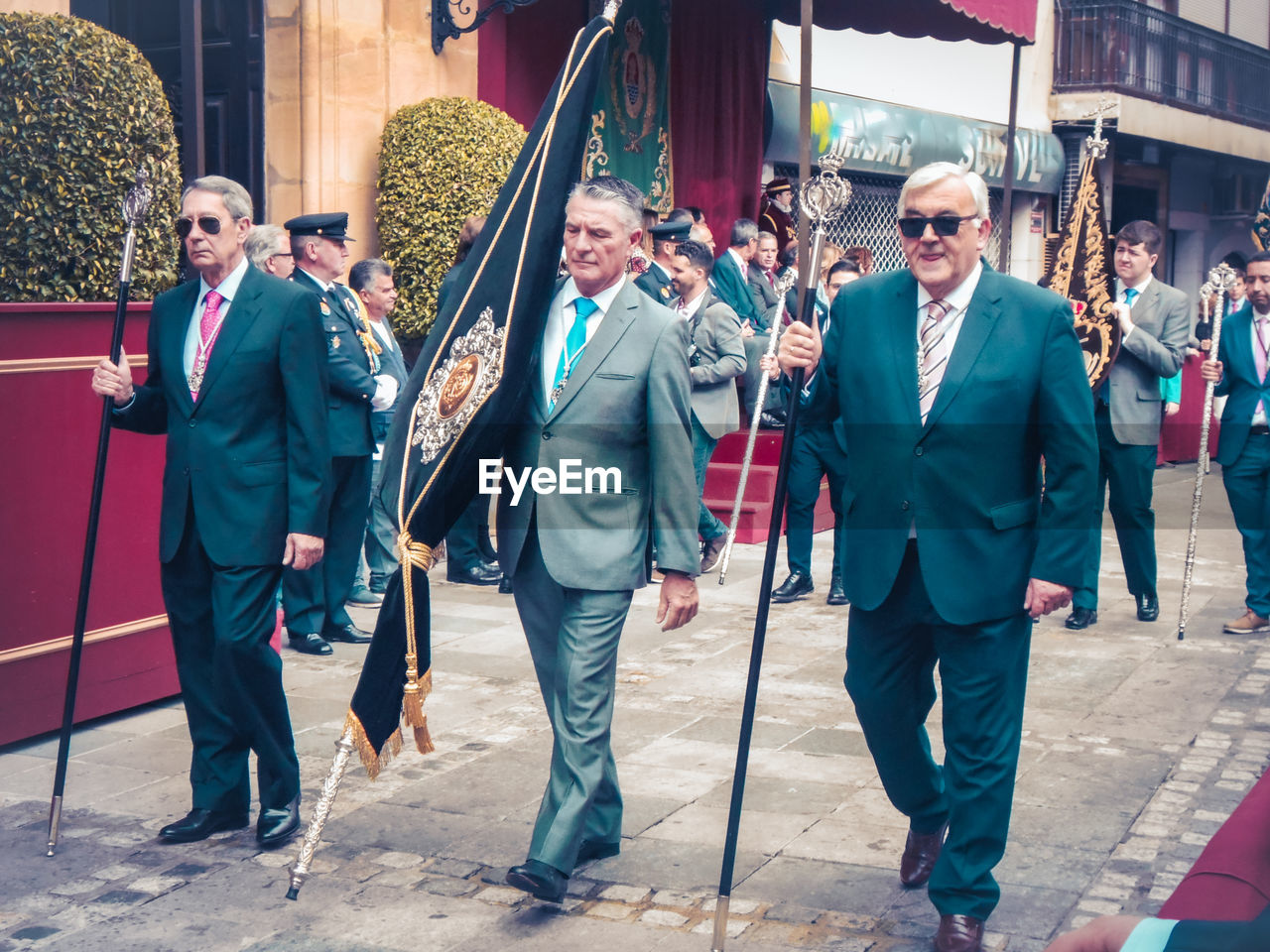 GROUP OF PEOPLE WALKING IN CITY STREET