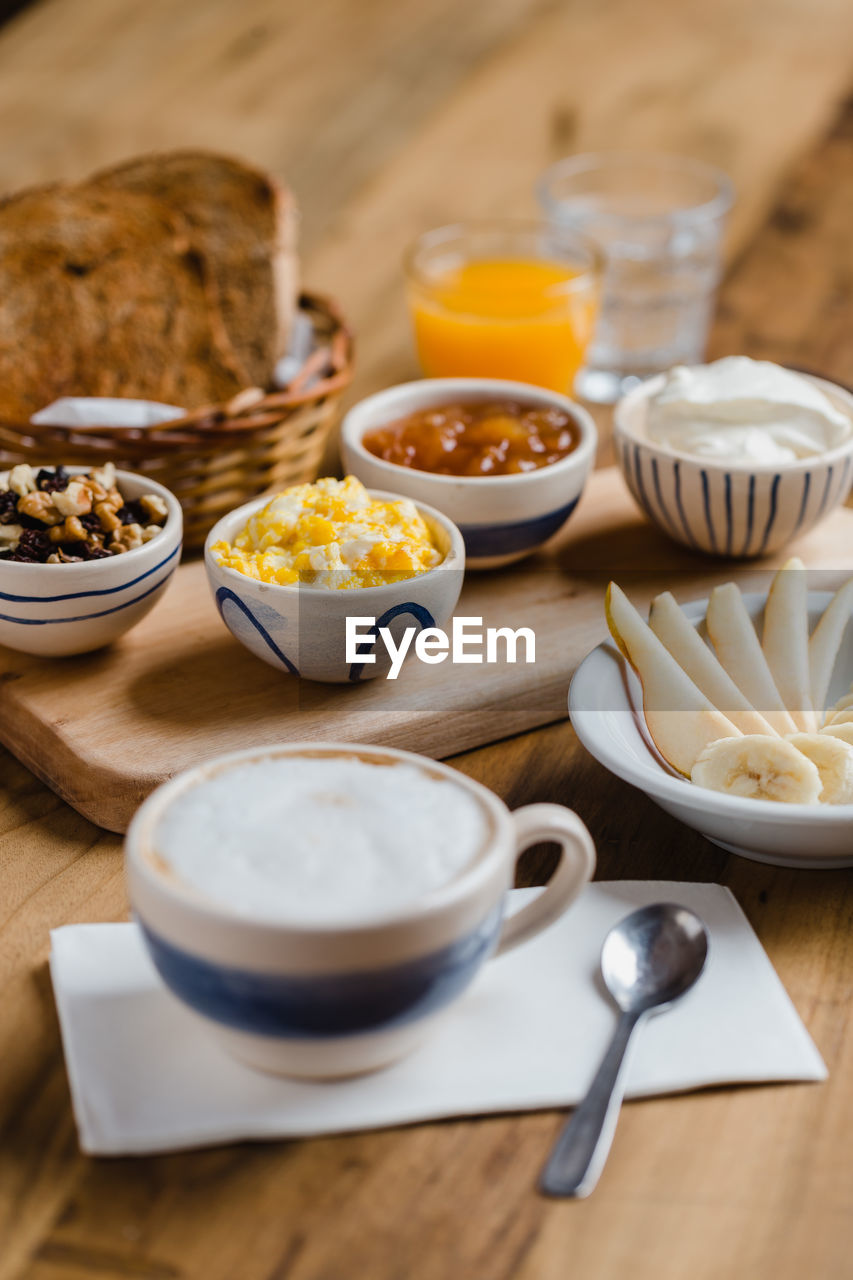 HIGH ANGLE VIEW OF BREAKFAST AND COFFEE ON TABLE