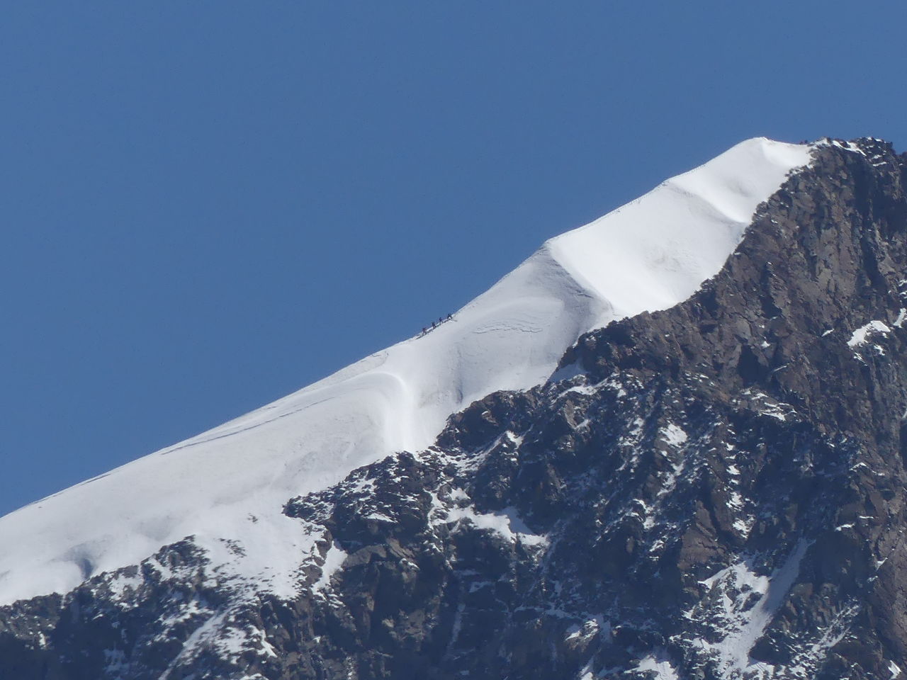 View of snowcapped mountains against clear blue sky