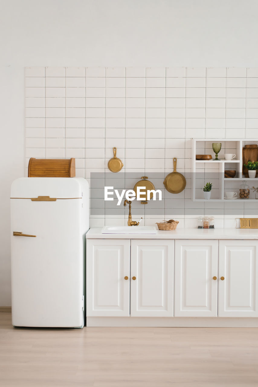 Interior of a stylish cozy modern white wooden kitchen