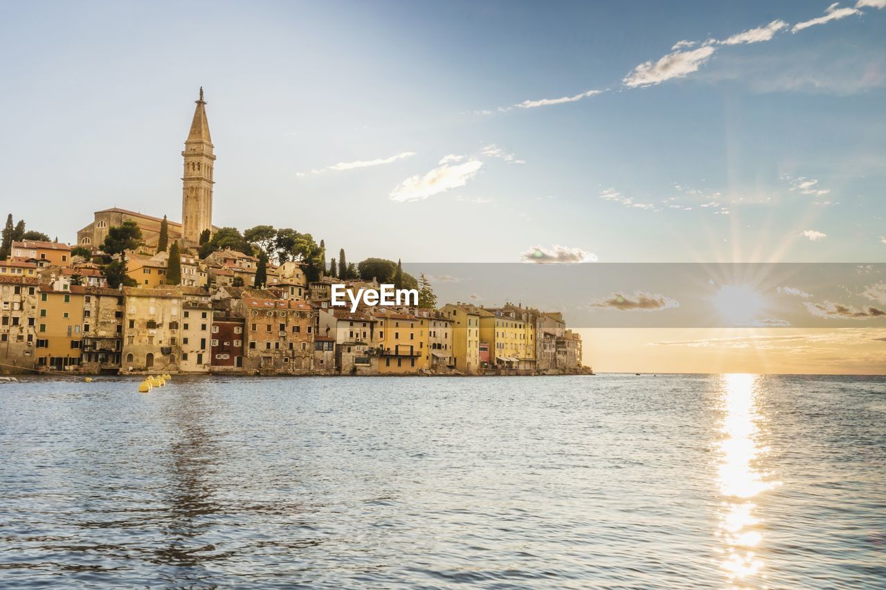 Buildings at waterfront rovinj croatia sunset