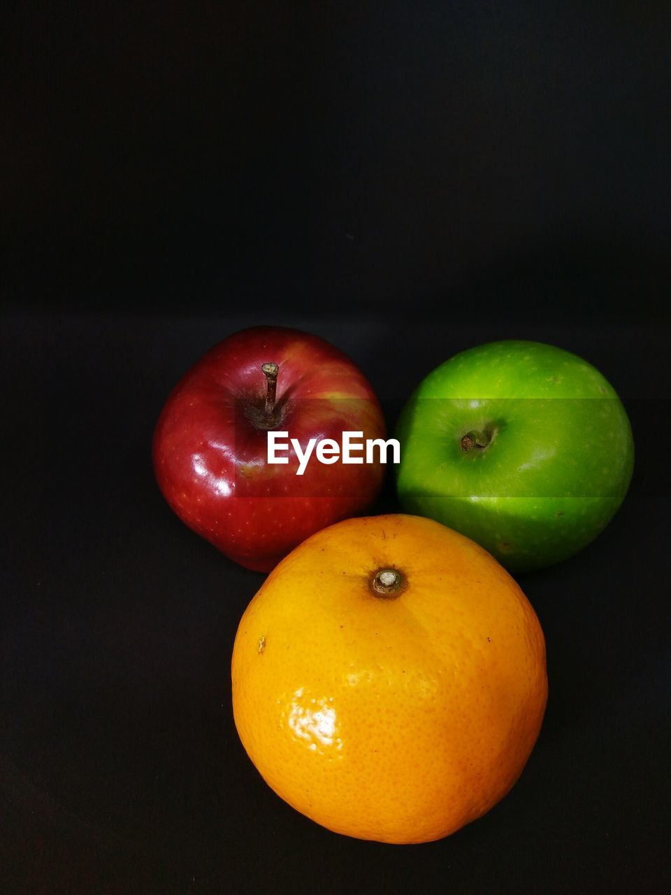 Close-up of fruits against black background