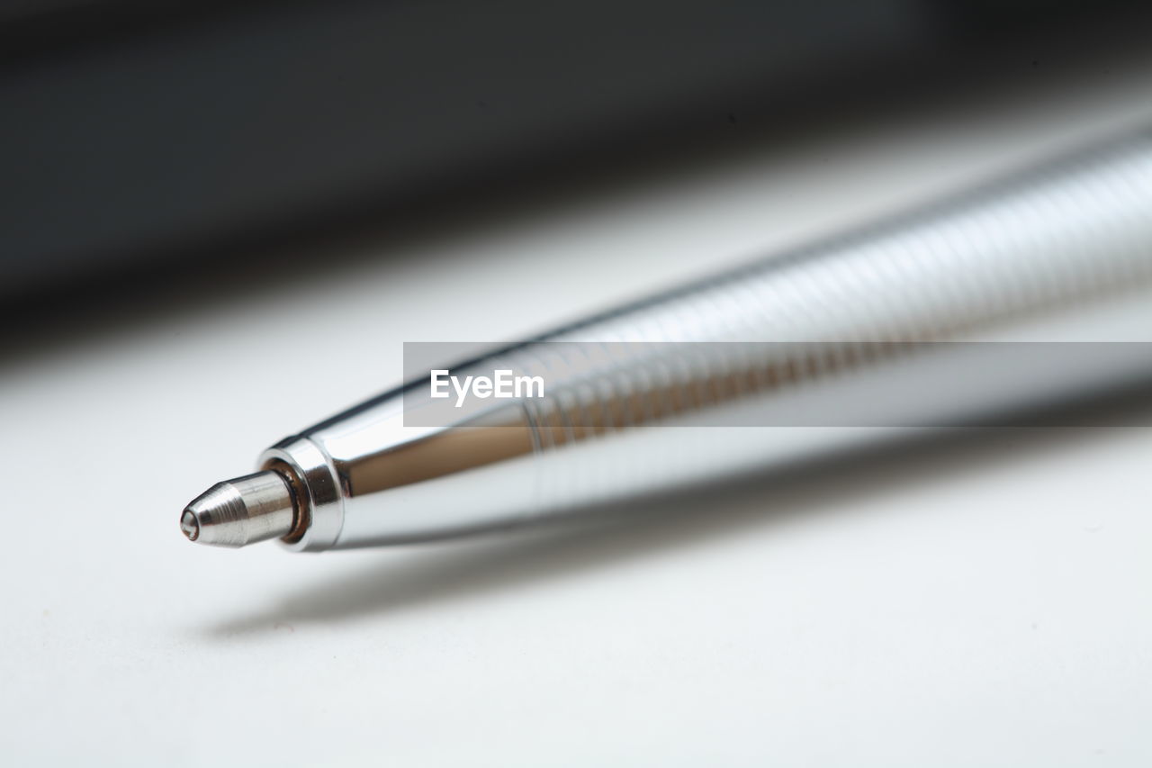 Close-up of pen on white background