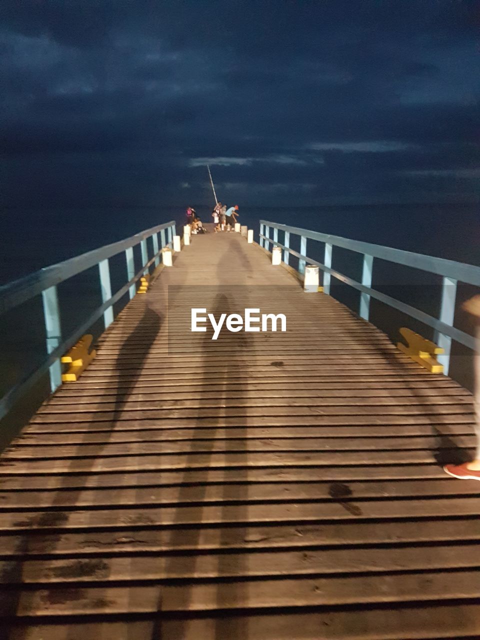 Pier over sea against sky