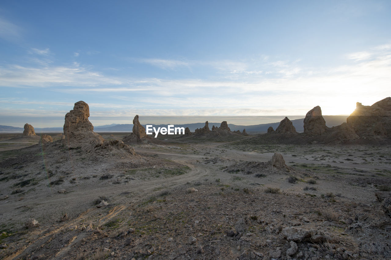 Trona pillars during sunrise against blue sky