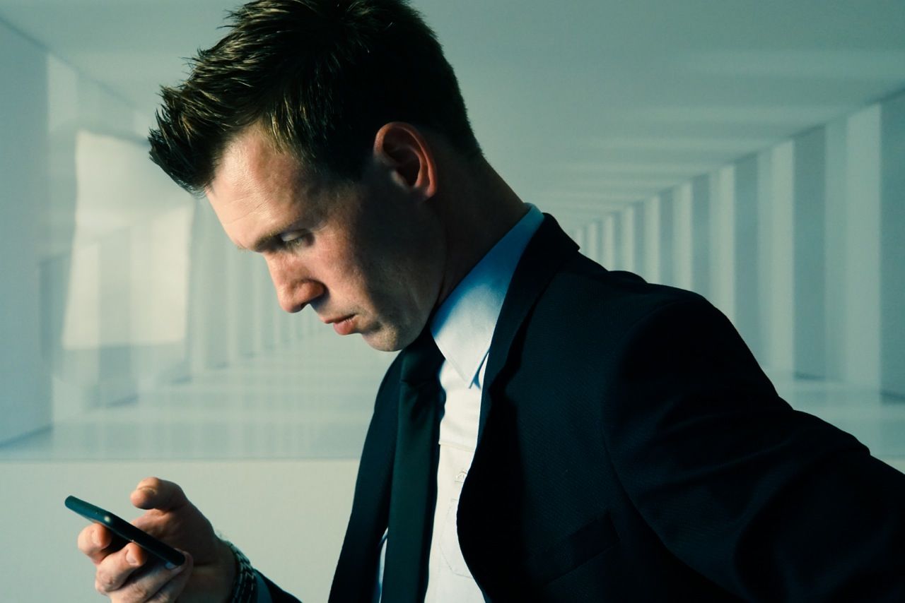 Businessman using smart phone in office building