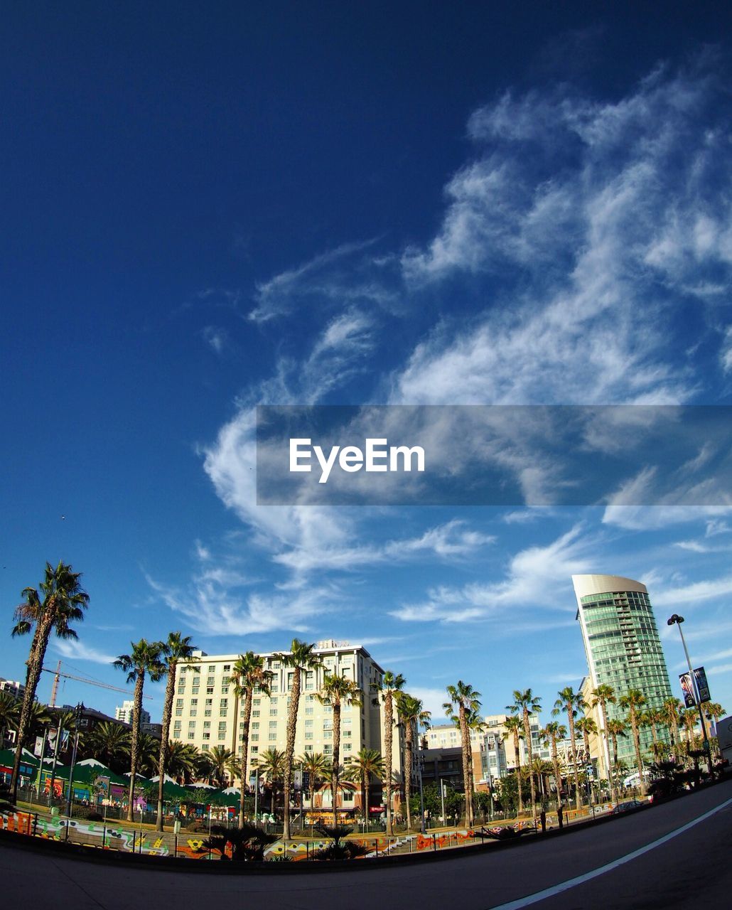 VIEW OF MODERN BUILDINGS AGAINST BLUE SKY