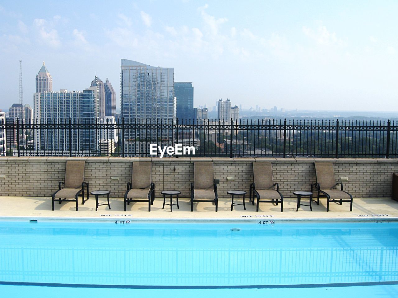 Swimming pool against buildings in city