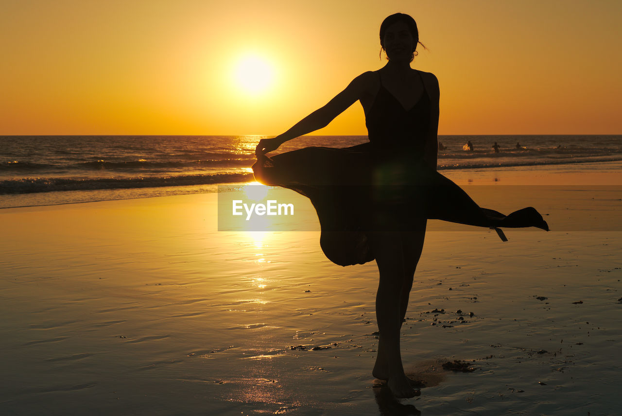 SILHOUETTE MAN AT BEACH DURING SUNSET