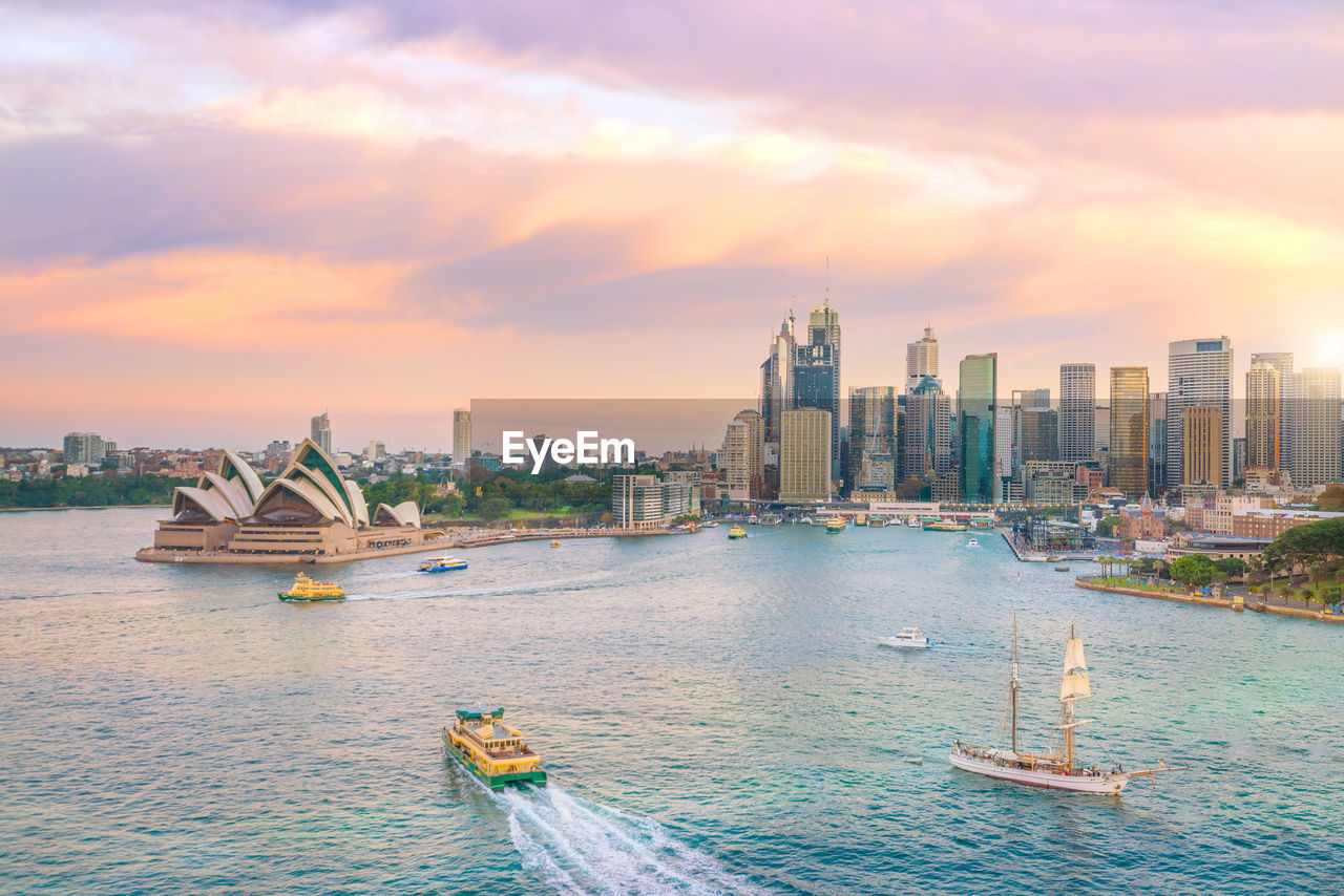 PANORAMIC VIEW OF SEA AND BUILDINGS AGAINST SKY