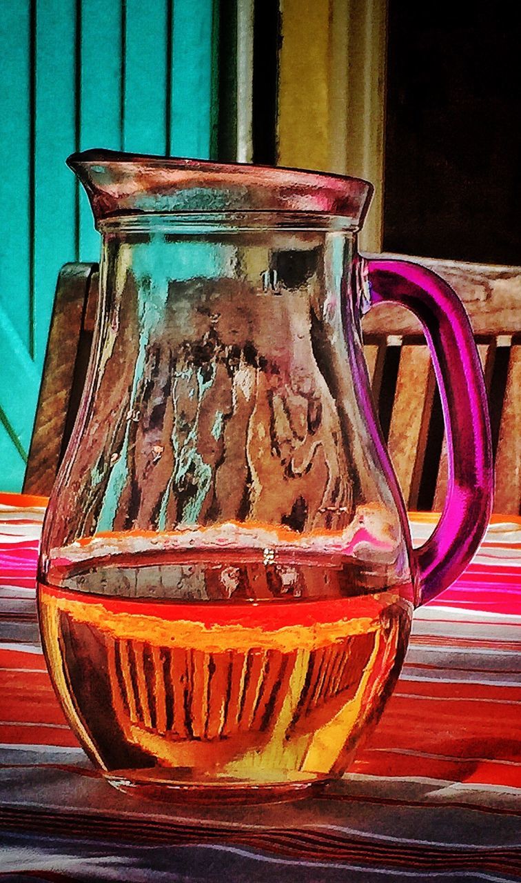 Close-up of drink in jug on table