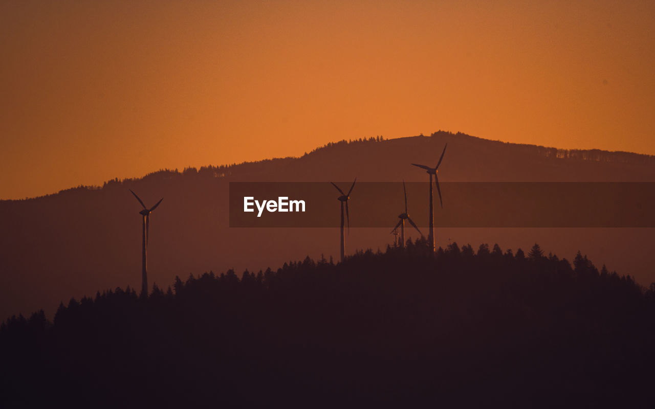 SILHOUETTE LANDSCAPE AGAINST SKY DURING SUNSET