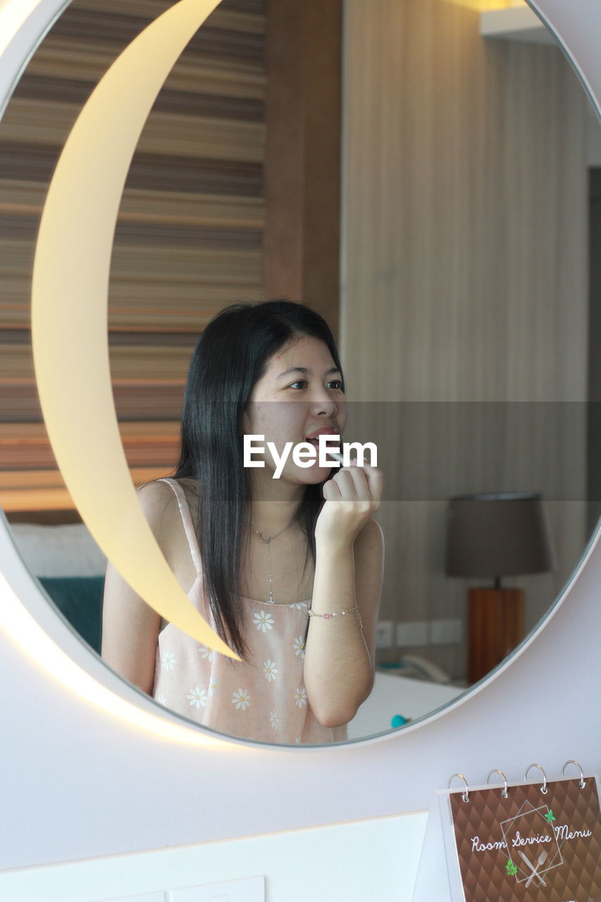 Portrait of young woman in bathroom