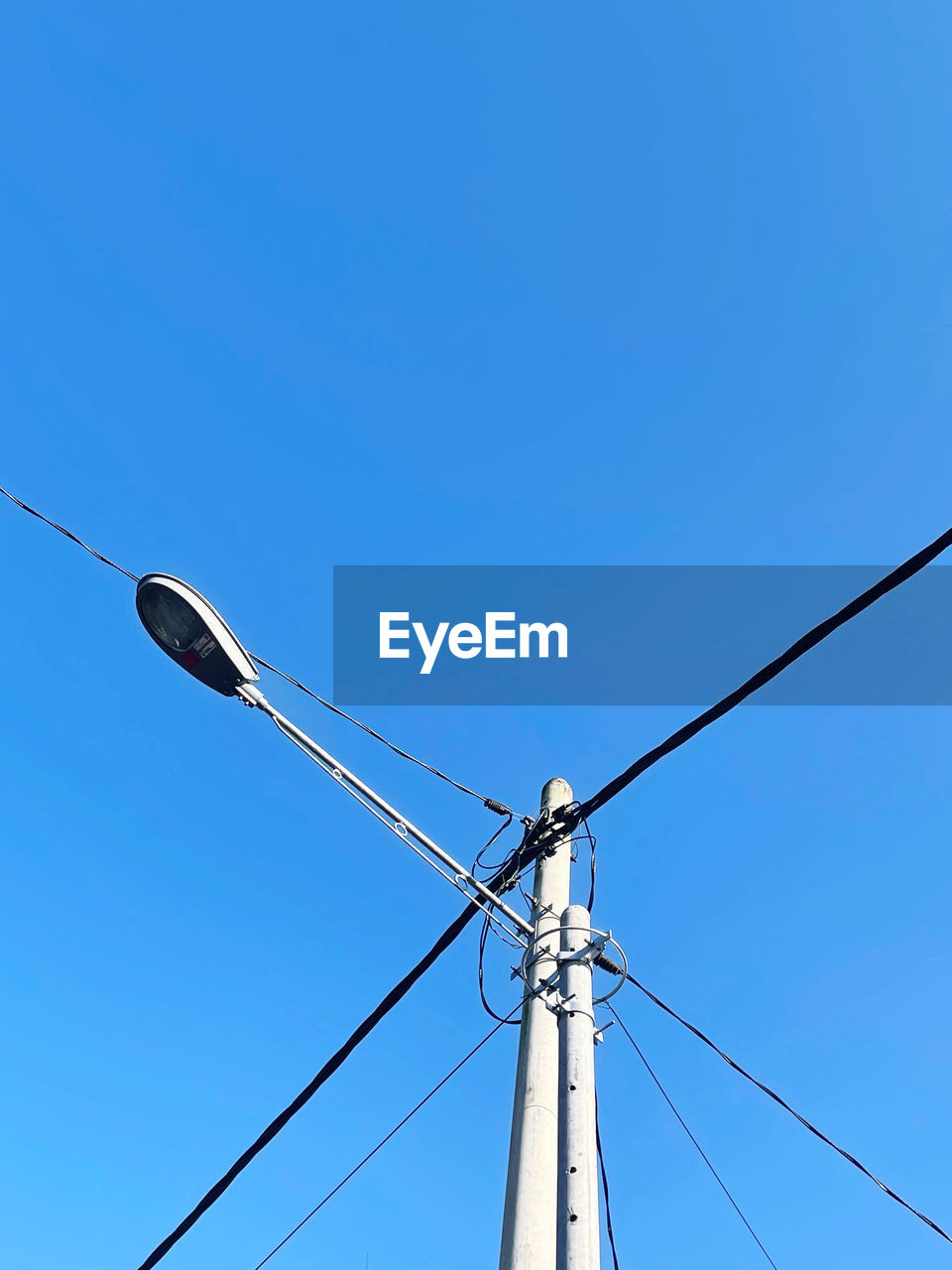 LOW ANGLE VIEW OF STREET LIGHT AGAINST SKY