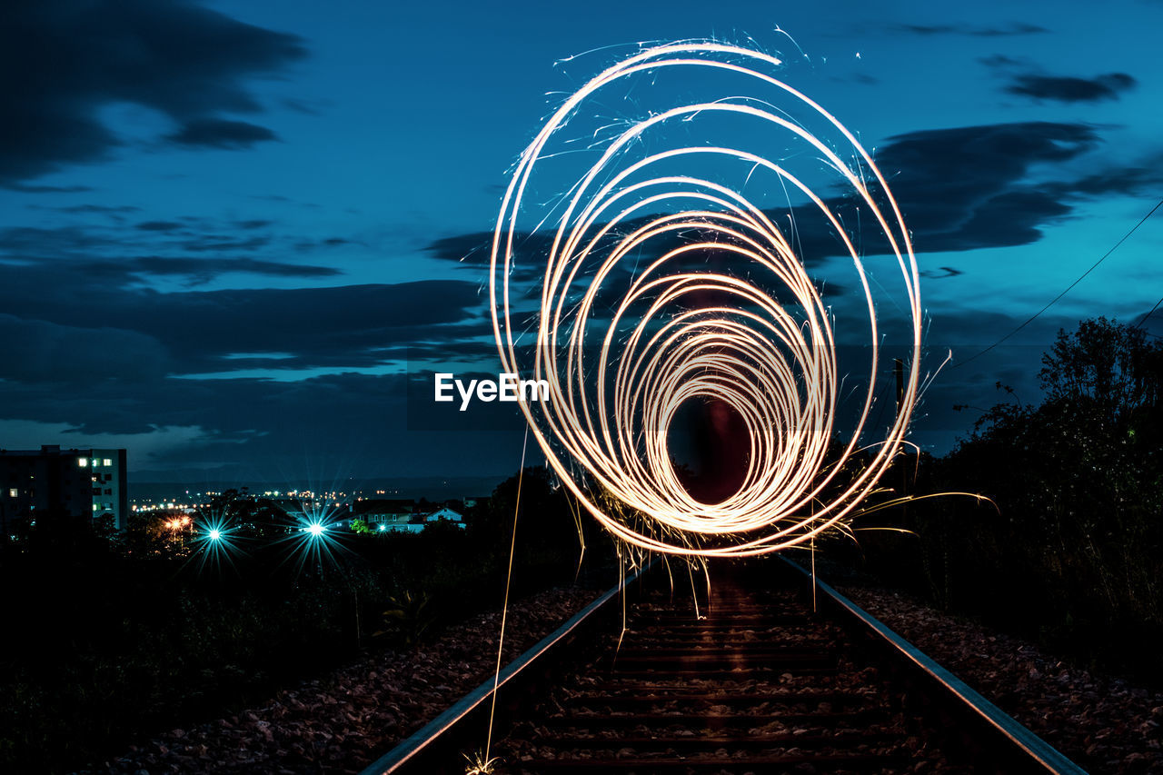 Light trails against sky at night