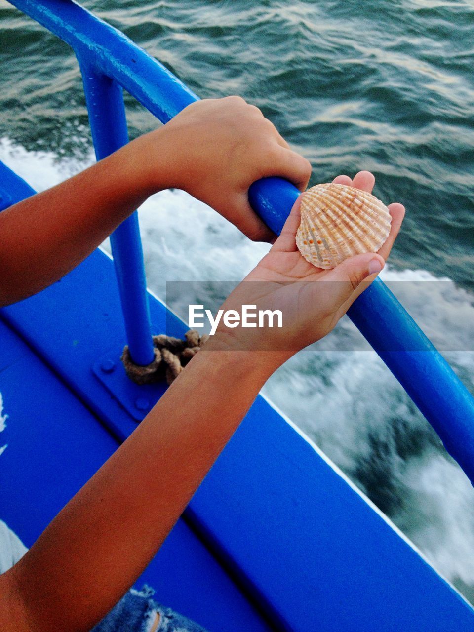 HIGH ANGLE VIEW OF YOUNG WOMAN IN WATER