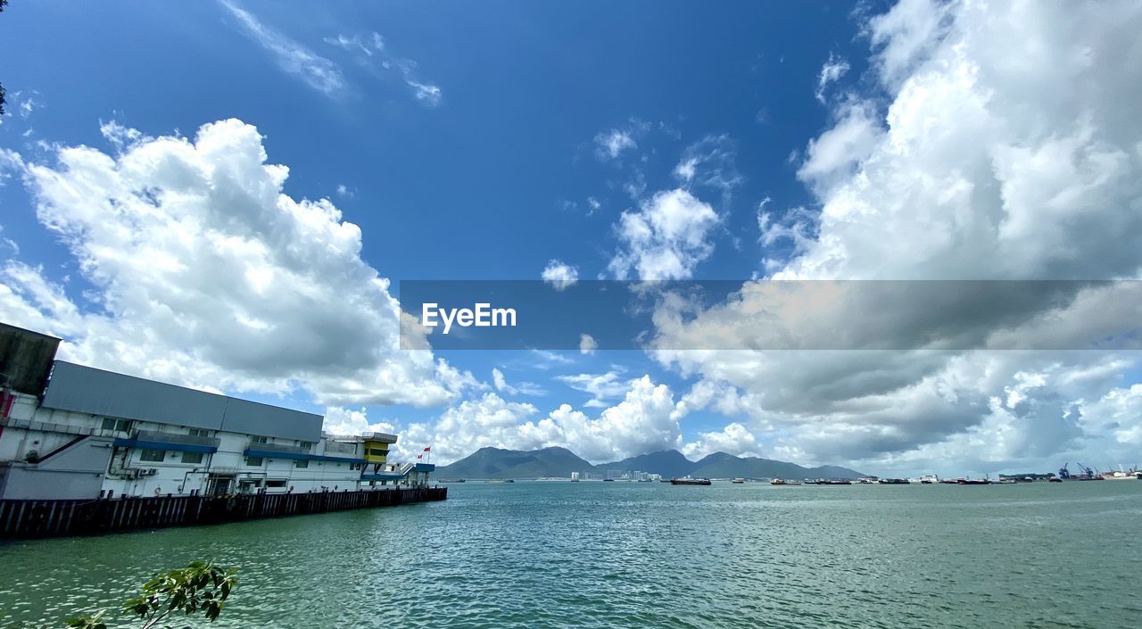 PANORAMIC VIEW OF SEA AGAINST CLOUDY SKY