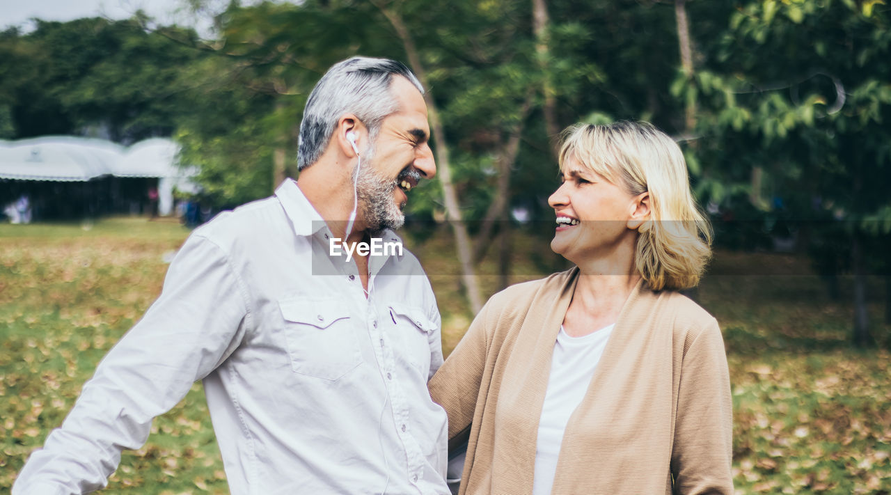 Cheerful couple standing outdoors