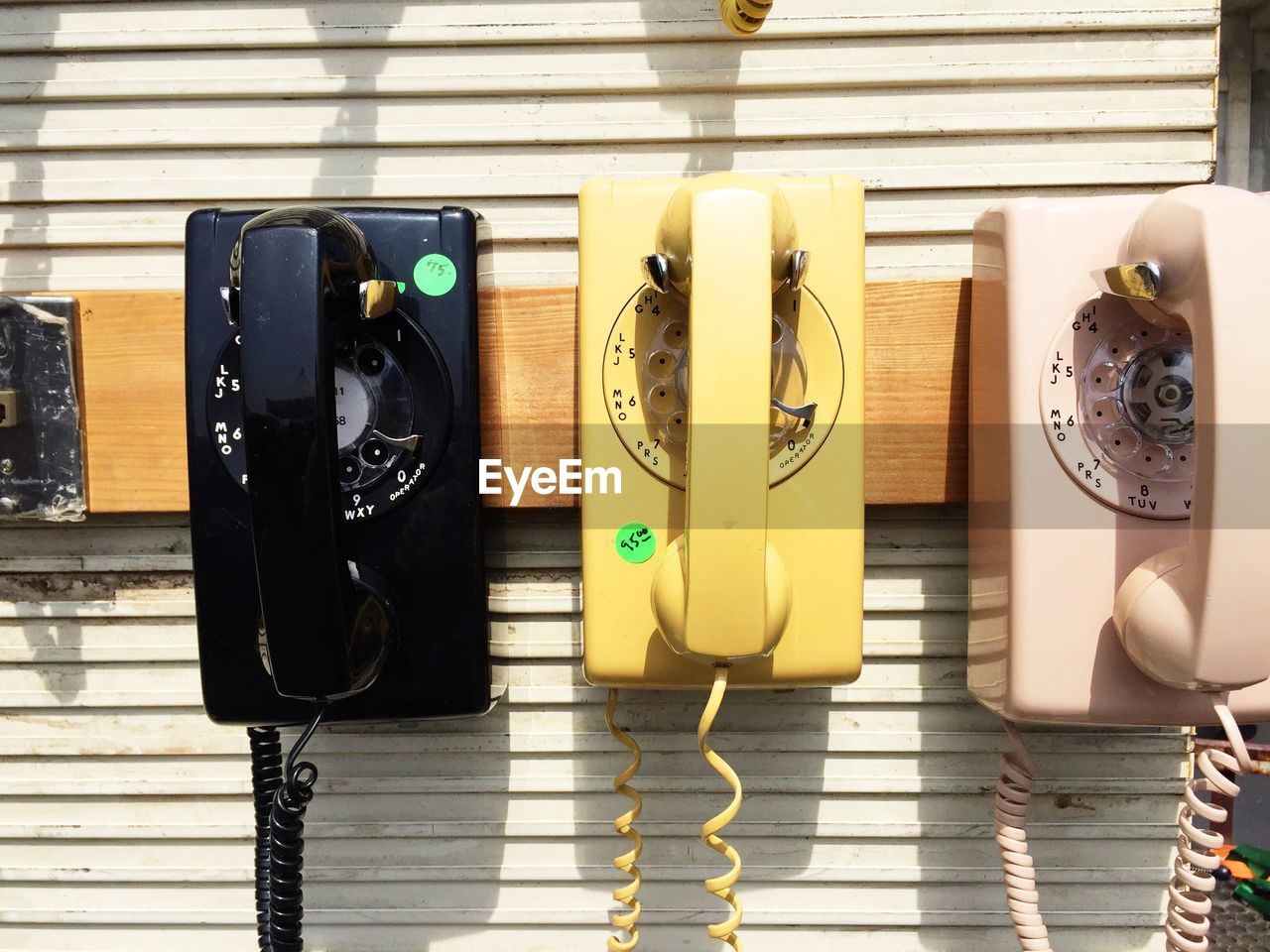 Old-fashioned telephones mounted on wall
