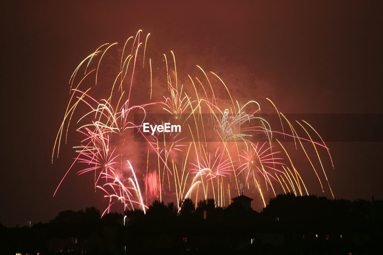 LOW ANGLE VIEW OF FIREWORK DISPLAY